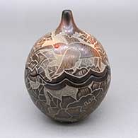Small black lidded gourd-shaped jar with a scalloped opening, sienna spots, inlaid stone details, and a sgraffito hummingbird, butterfly, flower, kiva step, and geometric design continuing across body and lid
 by Gwen Tafoya of Santa Clara
