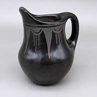 Black-on-black pitcher with a geometric design
 by Petra Montoya of Santa Clara