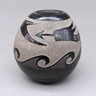 Small black jar with a sgraffito avanyu and wave geometric design
 by Corn Moquino of Santa Clara