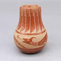 Small red jar with a sgraffito avanyu and feather ring geometric design
 by Corn Moquino of Santa Clara