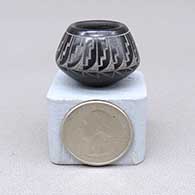Miniature black jar with a sgraffito feather ring, kiva step, and geometric design
 by Geri Naranjo of Santa Clara