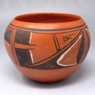Black-and-white-on-red bowl with a 4-direction geometric design
 by Kochahonawe of Hopi