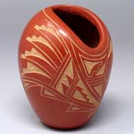 Red jar with an organic opening and a sgraffito corn plant and geometric design
 by Vangie Tafoya of Jemez