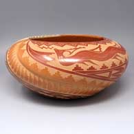Polychrome bowl partially carved with melon ribs plus a sgraffito avanyu, feather and geometric design
 by Vangie Tafoya of Jemez