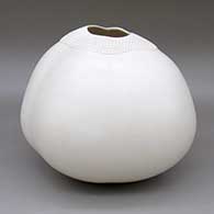 Large white jar with an organic form and a corrugated design around opening
 by Jacquie Stevens of Winnebago