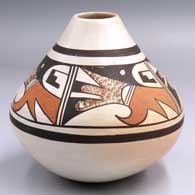 Polychrome jar with a 4-panel bird element and geometric design above the shoulder
 by Fawn Navasie of Hopi
