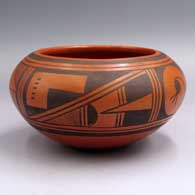 Black-on-red bowl with a 4-panel geometric design
 by Ethel Youvella of Hopi