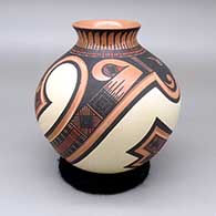 Polychrome jar with a flared opening and a lightly carved and painted geometric design
 by Tavo Silveira of Mata Ortiz and Casas Grandes