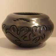 Black jar carved with elk design
 by Linda Tafoya of Santa Clara