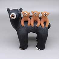 Polychrome bear storyteller with three cubs
 by Louis Naranjo of Cochiti