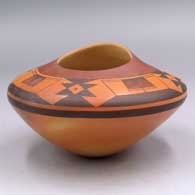 Polychrome jar with an organic opening and an 8-panel geometric design
 by Jacob Koopee of Hopi