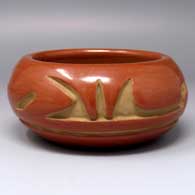 Red bowl carved with a 2-panel geometric design
 by Mary Cain of Santa Clara