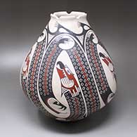 A polychrome jar with a notched rim and decorated with a five-panel Paquime serpent and geometric design
 by Humberto Ponce of Mata Ortiz and Casas Grandes