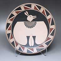 A polychrome plate with a Mimbres anthropomorph and geometric design
 by Sabino Villalba of Mata Ortiz and Casas Grandes
