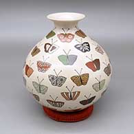 Polychrome jar with a flared opening and a butterfly design
 by Maribel Lopez of Mata Ortiz and Casas Grandes