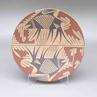 Polychrome plate with a two panel Mimbres style four-legged fish and geometric design
 by Arminda Silveira of Mata Ortiz and Casas Grandes