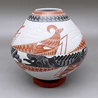 Polychrome jar with a sgraffito and lightly carved ram, bird, and geometric design against a textured background
 by Eduardo Quintana of Mata Ortiz and Casas Grandes