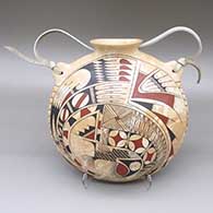 Polychrome marbleized clay canteen with a flared opening, a painted cuadrillos and geometric design, and a leather strap detail
 by Lupe and Rey Rodriguez of Mata Ortiz and Casas Grandes