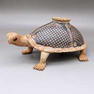 Black-on-red marbleized clay turtle effigy jar with a slightly flared opening and a painted cuadrillos and geometric design
 by Nicolas Ortiz of Mata Ortiz and Casas Grandes