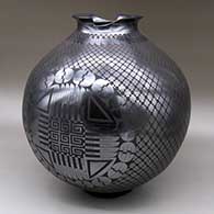 Large black-on-black jar with an organic cut and flared opening and a cuadrillos and geometric design
 by Naty Ortega of Mata Ortiz and Casas Grandes