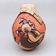 Small polychrome jar with a carved and painted dancer, cornstalk, and geometric design
 by Carla Nampeyo of Hopi