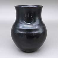 Black double-shouldered jar with a flared opening and two imprinted bear paw designs
 by Virginia Garcia of Santa Clara