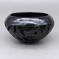 Small black-on-black bowl with a carved and painted avanyu design
 by Marie Suazo of Santa Clara