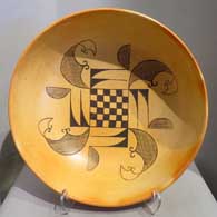 Large black on yellow bowl with fire clouds and geometric design inside
 by Unknown of Hopi