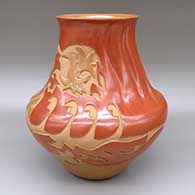 Red and sienna jar with a flared opening, an indented swirl melon design on the neck and body, and a carved avanyu, hummingbird, butterfly, dragonfly, cornstalk, feather ring, and geometric design
 by Sharon Naranjo Garcia of Santa Clara