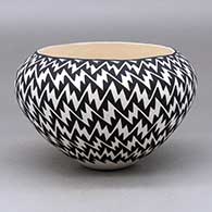 Click for a larger view A black on white bowl decorated on the outside with a lightning bolt geometric design
by Jennifer Estevan of Acoma
