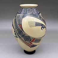 A polychrome jar decorated with a three-panel Paquime-style geometric design
 by Noe Quezada of Mata Ortiz and Casas Grandes