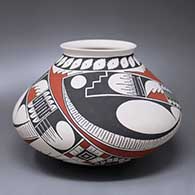 A polychrome jar with an everted lip and a three-panel Paquime geometric design
 by Damian Quezada of Mata Ortiz and Casas Grandes