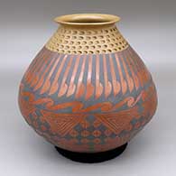 Polychrome jar with a flared opening, an indented design below rim, and a painted cuadrillos and geometric design
 by Jose Silveira of Mata Ortiz and Casas Grandes