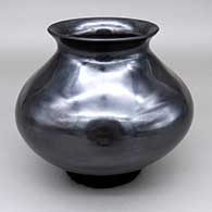 Polished gunmetal jar with a flared opening
 by Nena Ortiz of Mata Ortiz and Casas Grandes