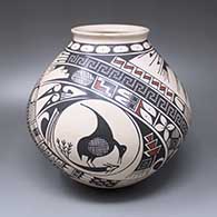 A polychrome jar with an everted rim and decorated with a three-panel Paquime bird, fish and geometric design
 by Ana Trillo of Mata Ortiz and Casas Grandes