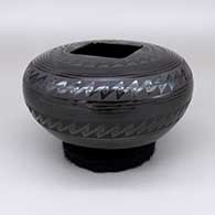 Black-on-black jar with a square opening and a geometric design
 by Ruben Rodriguez of Mata Ortiz and Casas Grandes