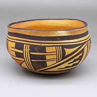 A polychrome bowl decorated with a four-panel Payupki-style geometric design
 by Unknown of Hopi