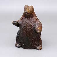 Red bear figure with a pine pitch coating and fire clouds
 by Louise Goodman of Dineh
