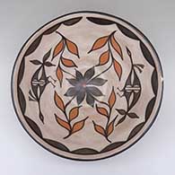 Polychrome bowl with a bird, flower, and geometric design
 by Ambrose Atencio of Santo Domingo
