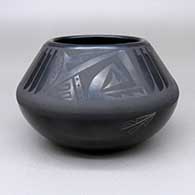 Black-on-black bowl with a sgraffito and painted feather ring and geometric design and an inlaid jasper stone detail
 by Cavan Gonzales of San Ildefonso