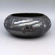 Black-on-black bowl with a geometric design
 by Maria Martinez of San Ildefonso