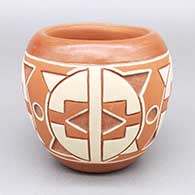 Polychrome jar with a lightly carved and painted four-panel geometric design
 by Norman de Herrera of Ohkay Owingeh