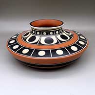A polychrome low-shoulder jar decorated with bands of solid and geometric design
 by Thomas Tenorio of Santo Domingo
