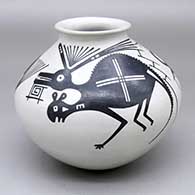 A brown-on-tan jar with a flared rim and decorated with a Mimbres animal and insect design
 by Juan Quezada Jr of Mata Ortiz and Casas Grandes