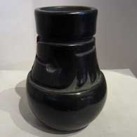 Long neck carved black jar 
 by Margaret Tafoya of Santa Clara