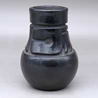 Long neck carved black jar 
 by Margaret Tafoya of Santa Clara