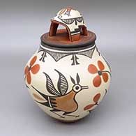 Polychrome lidded jar with a traditional Zia design featuring roadrunner, flower, and geometric elements and a matching lid with a turtle applique detail
 by Elizabeth Medina of Zia