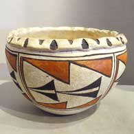 Polychrome bowl with a pie crust rim and a 5-panel geometric design
 by Unknown of Acoma
