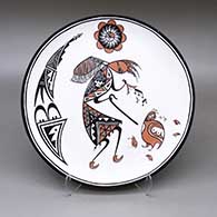 Polychrome plate with a kokopelli, quail, music note, sun face, fine line, and geometric design
 by Dean Reano of Acoma