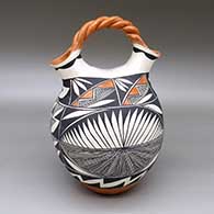 Polychrome wedding vase with a braided handle and a fine line, feather ring, and geometric design
 by Ruby Shroulote of Acoma
